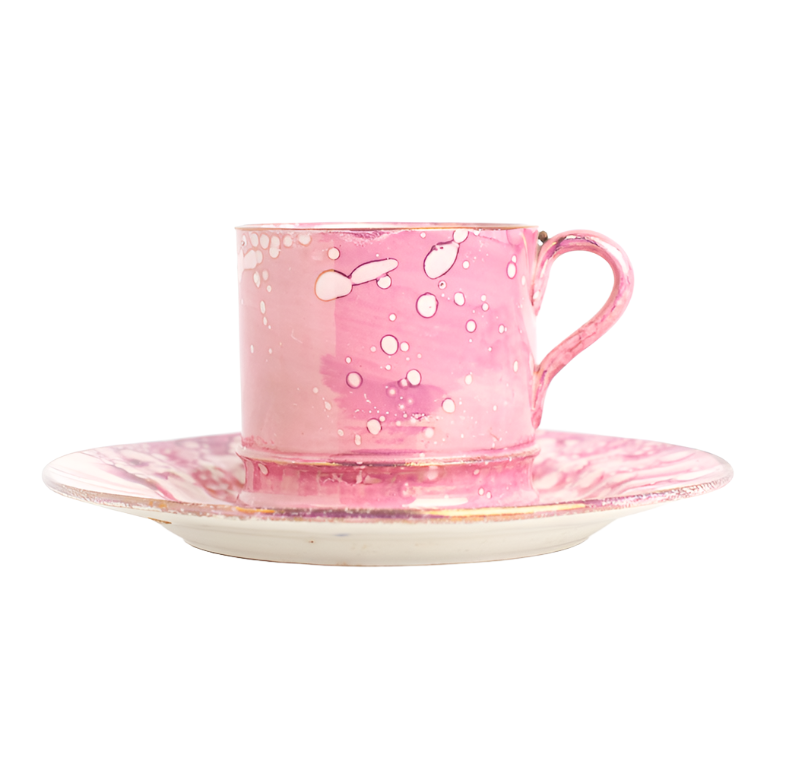 pink splattered glaze on antique teacup and saucer with irridescent look